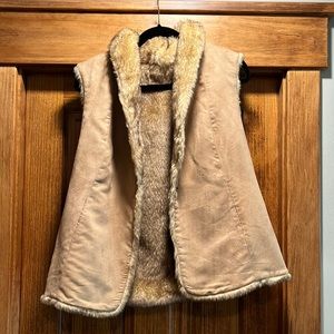 Suede vest with faux fur lining.